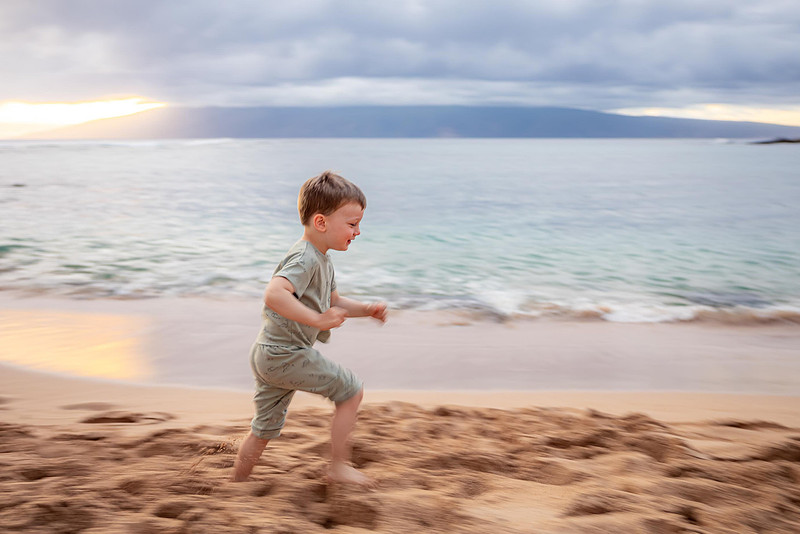 Variety of sunset portraits featuring a family with two young boys. Location: Napili Bay, Maui, Hawaii. 