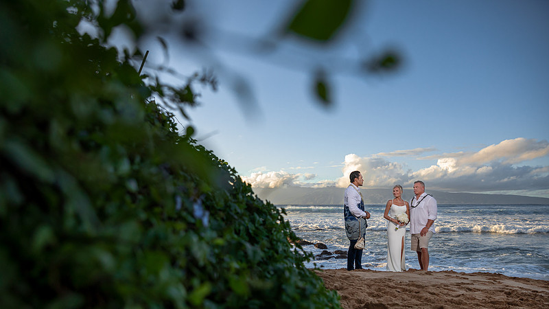West Maui beach elopement at Napili Bay. Officiated by Kahu Kale Kaalekahi. Florals by Aloha Flower Co. Photography by Madelynne Lorraine.