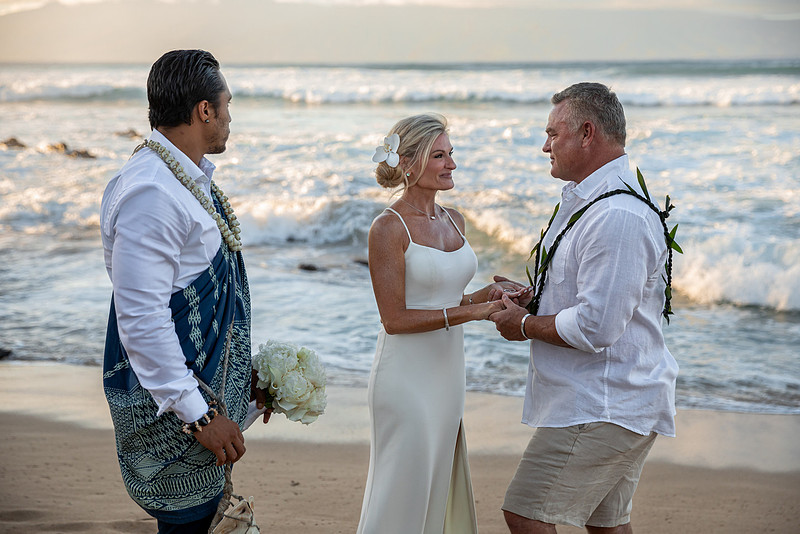 West Maui beach elopement at Napili Bay. Officiated by Kahu Kale Kaalekahi. Florals by Aloha Flower Co. Photography by Madelynne Lorraine.