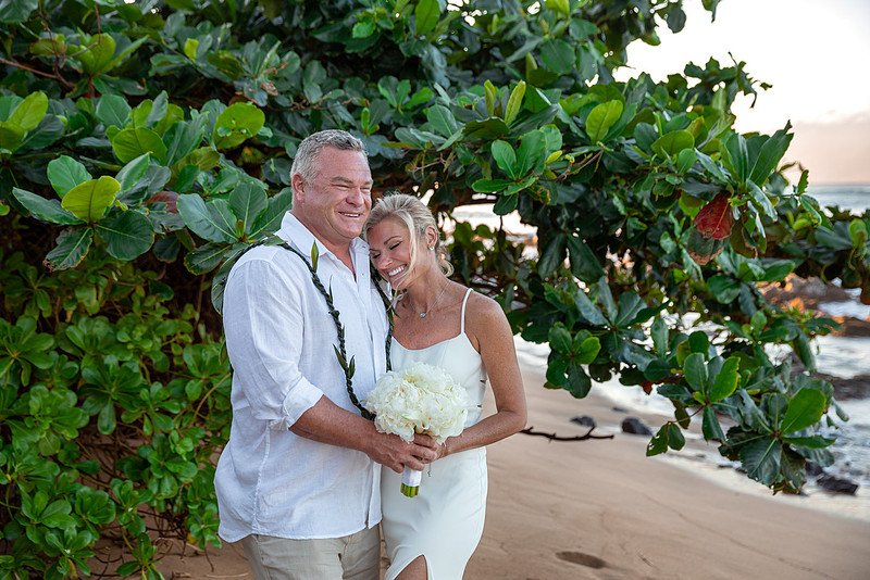 West Maui beach elopement at Napili Bay. Officiated by Kahu Kale Kaalekahi. Florals by Aloha Flower Co. Photography by Madelynne Lorraine.